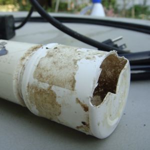 Old med. bottle cut for tube in and water out. Level in tube regulated by angle of mounting of tube and size of cut out. and rate of flow for the pump..