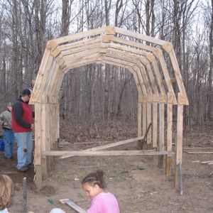 Hardwood ribs, plywood gussets, treated 4x4 2' in ground.