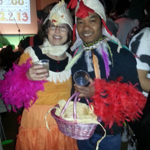 us, as chickens... me being the laying hen with eggs in basket; hubby being the thai fighting cock...