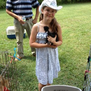 My daughter Emma with our Black Showgirl pullet :)