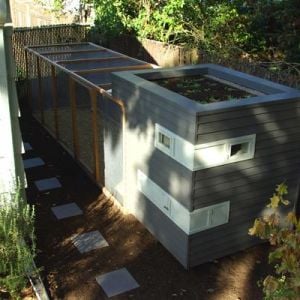 CREATOR: gd-jpeg v1.0 (using IJG JPEG v80), quality = 75
Mitchell Snyder's chicken coop combines the look of a modern prefab house with the green beauty of a rooftop garden. Located in Portland, Ore., the coop is big enough for five chickens . The coop has a large run covered with wire mesh fencing and perfectly complements the 1924 craftsman bungalow behind which it sits.