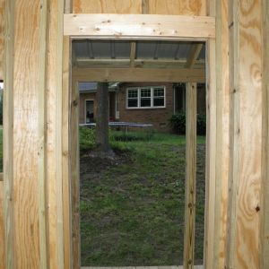 Looking out the front door of the coop up to the house.