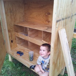 My son Garrett testing out the chicken coop