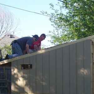 DH and his best friend working on the coop.