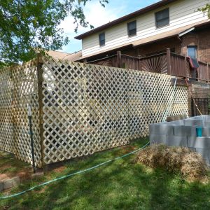 lattice on two sides - the side facing the pool will be left as hardware cloth so we can see the chickens when we're by the pool