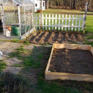 Raised bed, corn rows, bird bath and greenhouse :)