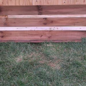A close up of the fence panels. The light colored wood is just some 1x's used to give the appearance of cabin chinking. I will use 1x3's for that part. I will paint those boards the same color as my chinking on my cabin. I will post more updates as the transformation progresses.