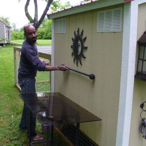 Plant table on side of Coop KenJi