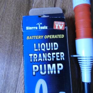 Liquid transfer pump, I purchased this one for under $7.00.  Its worth it's weight in gold.  It empted my kiddy pool which was 3/4 full in just over 7 minutes!  But I do suggest adding a cut off piece of hose to drain the water further from the pool.