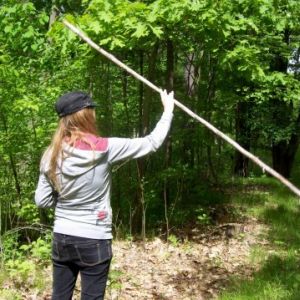 Twirling her staff.