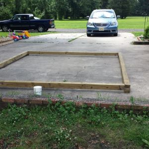 I cut and assembled the 4x4 on our flat parking pad, also drilled the anchor holes to anchor it  to the 8" concrete tubes.