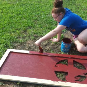 Emily painting her door