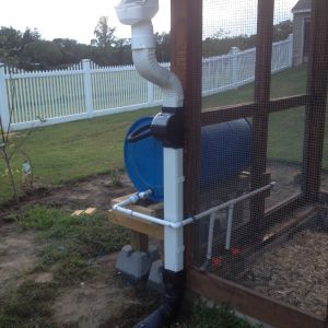 Side view of completed rain barrel watering system