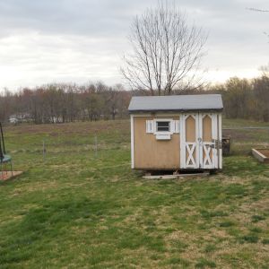 Moved a free old yard barn from local farm to our backyard using a tractor. We set the yard bard on a hay bail lifter and used ratchet straps.