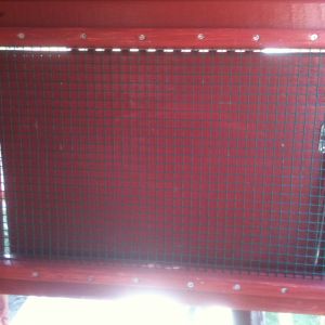 Window easy to do. Staple wire and add a screwed in trim so it can't be pulled out.