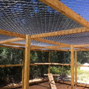 Chain link fence put on top, we added a cool shade tarp that covers the entire top.  That help tremendously with the intense Texas summers