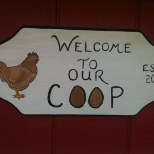 a sign i hand painted for the front of the coop