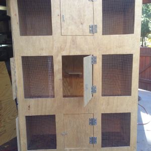 Scrap plywood were nailed on the left side for the heat lamps to clamp on when necessary.