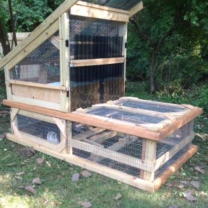 I designed this chicken tractor to blend with deck and patio sections in my yard.   It uses the rear axel and wheels from an EZ GO golf cart connected to the frame with a 6 part  line  to raise the frame about 8 inches off the ground to relocate the CT.