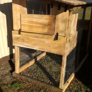 This coop is mostly reclaimed lumber; some rough-cut directly from my landlord's small pine mill. 8'x4' base, 6'-5' roofline. The hinges and latches for the cleaning door and main door are made of belt leather. Used ~128 sqft chicken wire. Nesting box separate from roosting area.