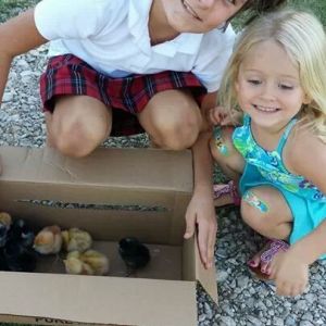 My beautiful daughter Brooke and niece Avery with the baby chicks the day they were adopted.