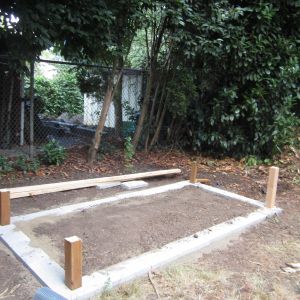 The brick base for the coop. **Originally we were going to dig the posts into the ground and it actually would have been better-you can see later that we had problems with the coop leaning that could have been avoided with just digging the posts in the ground instead.