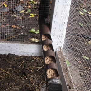 Feeding system. **Needs to be a bit wider, the feed doesn't quite slide down the tube and we have to bang on it to get it to fill up