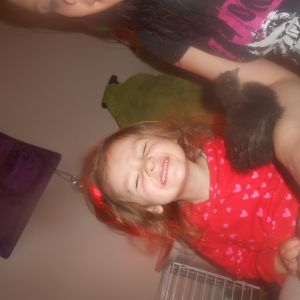My daughter smilin hard with "her" Black Silkie Ravyn.:) "Cheese!"