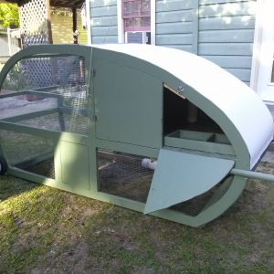 this side has two doors. one for getting eggs and a larger to clean the whole thing out.