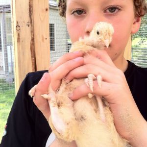 Tyler holding Chicken Little (5 wks)