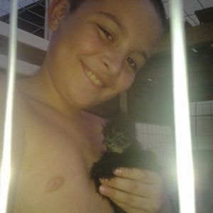 This is my youngest son Liam with our silkie Cotton*