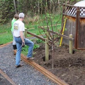 We started with four sturdy posts sunk 20" into the ground, then built a frame on top.