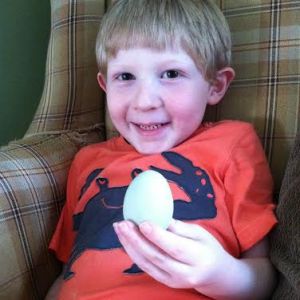Rowan with his chicken's first egg