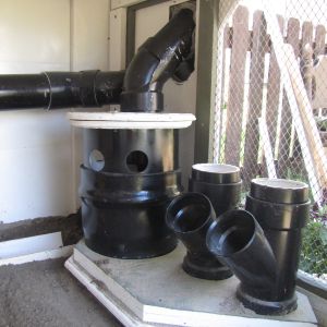 Close up of feed and water system, smaller feeders are for oyster shell and grit