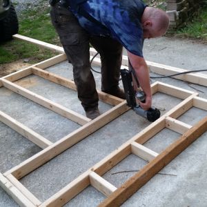 DH framing the inside wall - separating coop from garden shop