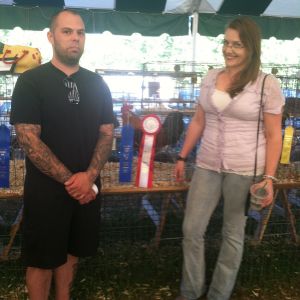 Proud Mom and Dad with our champion cock of show