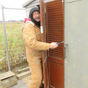 "Our hero!" from, The Girls 
John is installing a varmint proof, yet ventilated door with latch: it's perfect!