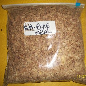 Chicken bones, organs and some meat ground down and stored to be used for feeding to chickens in breeding season.