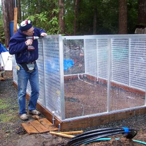 DH building the greenhouse in Spring of 2012