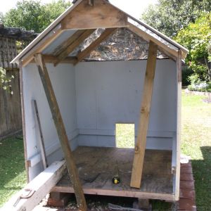 Silver insulation paper to prevent condensation from underside of corrugated metal roof.