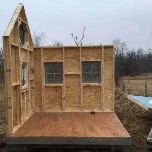 Two walls up. I built the walls in my garage waiting for the weather to get warm enough to dig the post holes.