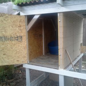 side door, will have nesting boxes & a storage area installed