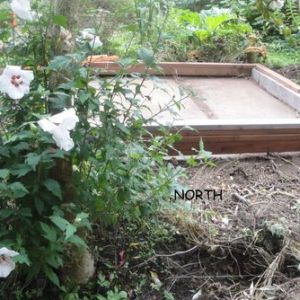 Cement slab and foundation of Tudor style chick house.
