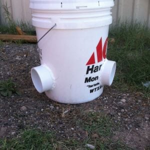 Less mess chicken feeder.
5 gallon bucket with lid 
3 3 inch pipe elbows 
Silicon