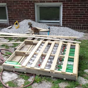 bottom view of soda bottle/pallet dock almost complete