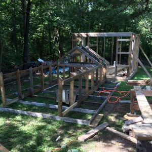 Now the roof. Given that I am building this by myself I thought it might be easier to build the roof/storage section on the ground and then raise it up later. I built the 2'x4 ceiling and rim joists then the center section. I did not attach them together as I figured it would be easier to put them up separately as well.