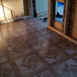 put down the cheap stick on tile for easy clean up