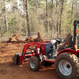 Weekend warrior at my brother's future homestead.  More stump moving, leveling, log moving, equipment hauling...