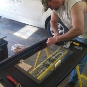 David working on our brooder box. We made it from a 50 gallon storage tub. Ideas were gathered from this website.