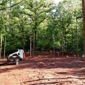 Posts set for main framing.  6" round pipe.  Unusual, I know.  But it is my brothers.  Will be interesting to watch this come together.  80X40 with loft, open/vaulted ceilings, steel frame, steel roof, steel siding, walk out, storm shelter.....